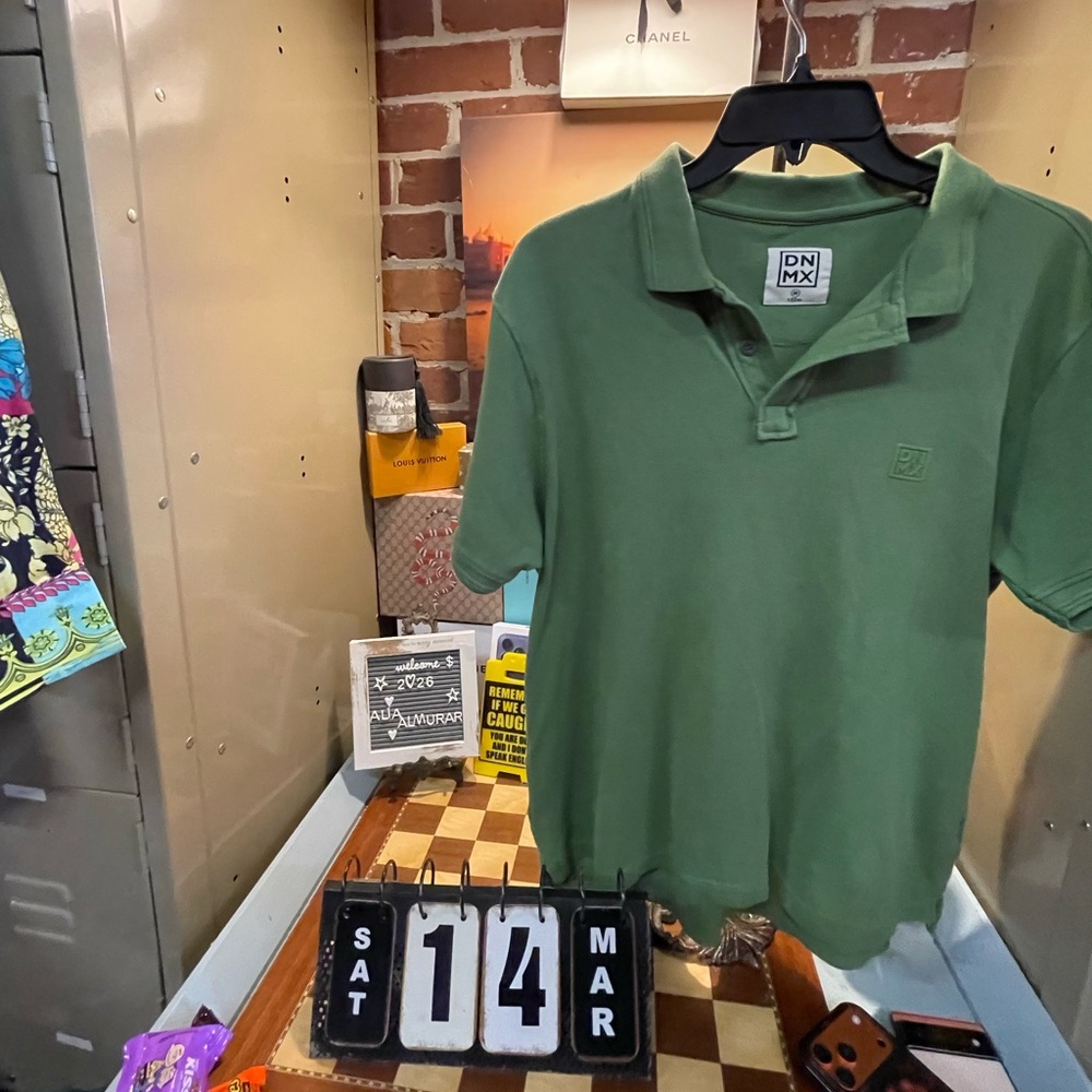 DNMX green polo shirt featuring a textured piqué design